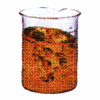 Beaker with orange liquid.